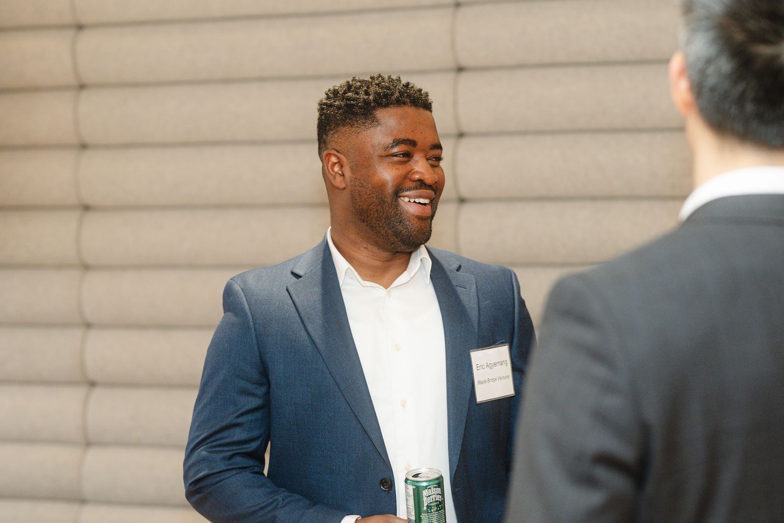 Guests sharing a laugh at Maple Bridge Exchange